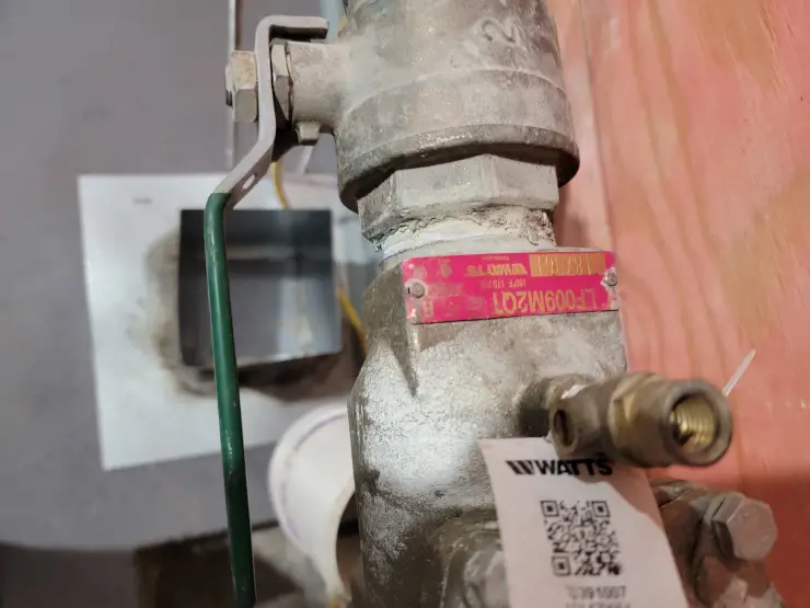 A tagged residential backflow assembly after annual testing and SWBNO certification